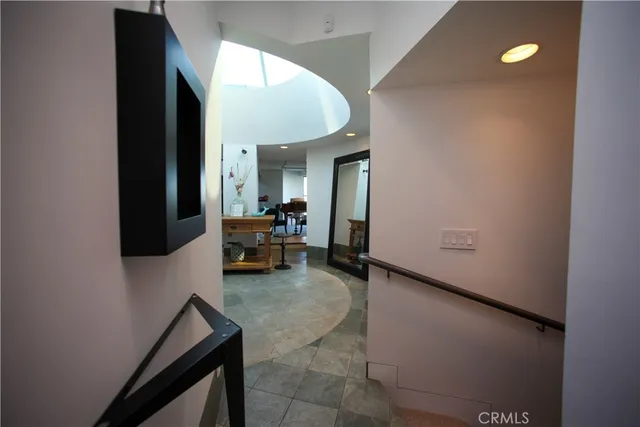 a view of a livingroom with furniture and a fan