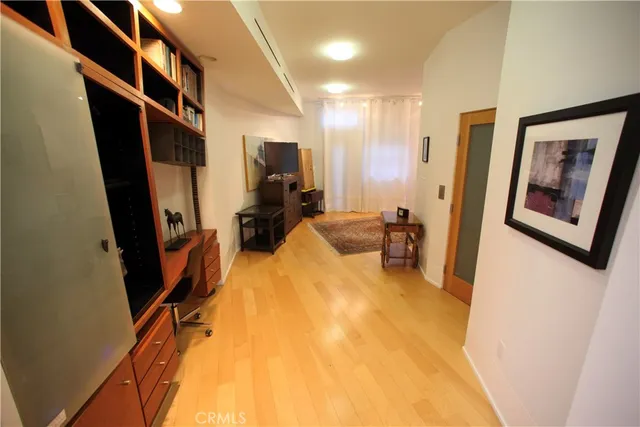 a view of a living room with furniture and a flat screen tv