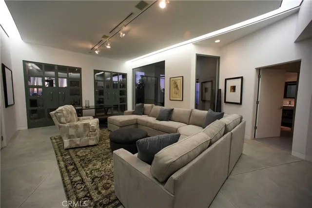 a living room with furniture and large window