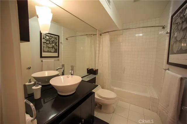 a living room with a bed and furniture