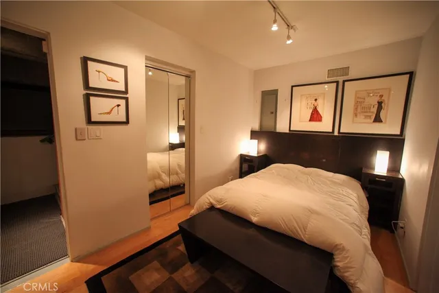 a living room with furniture and a mirror