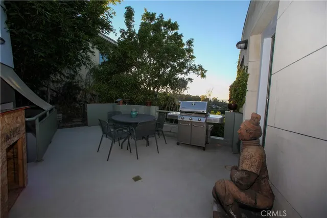 a swimming pool with outdoor seating and yard
