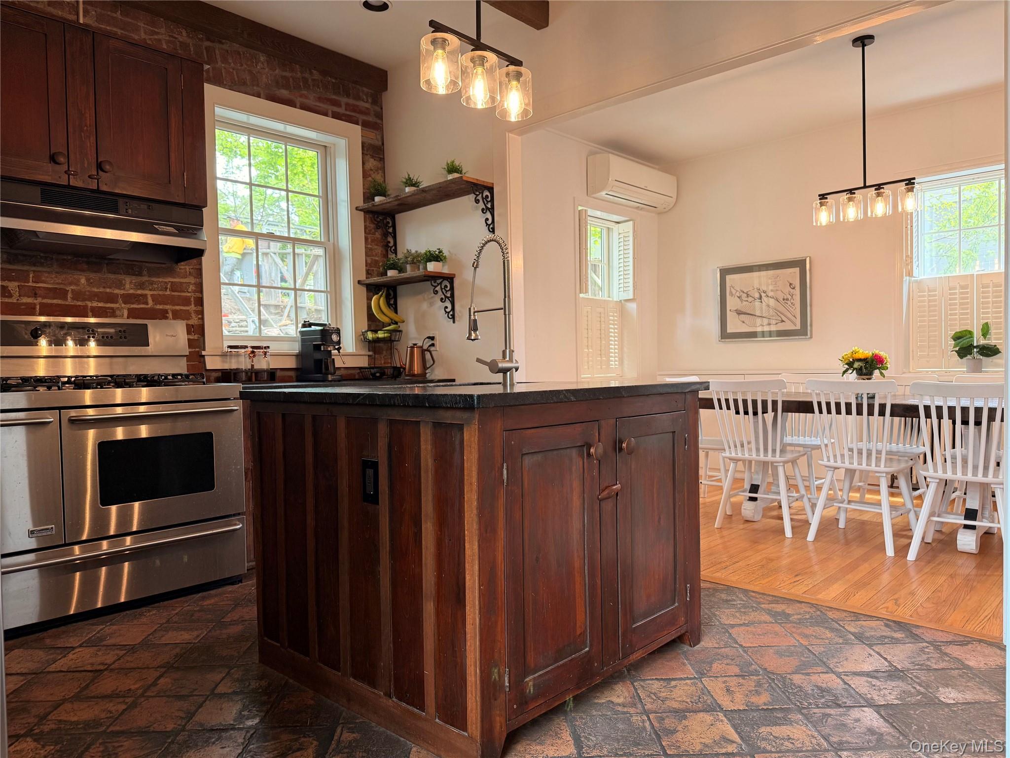 6 Church Street Cold Spring, NY 10516 - Photo 2 of 15 a kitchen with stainless steel appliances granite countertop a stove a sink and a microwave