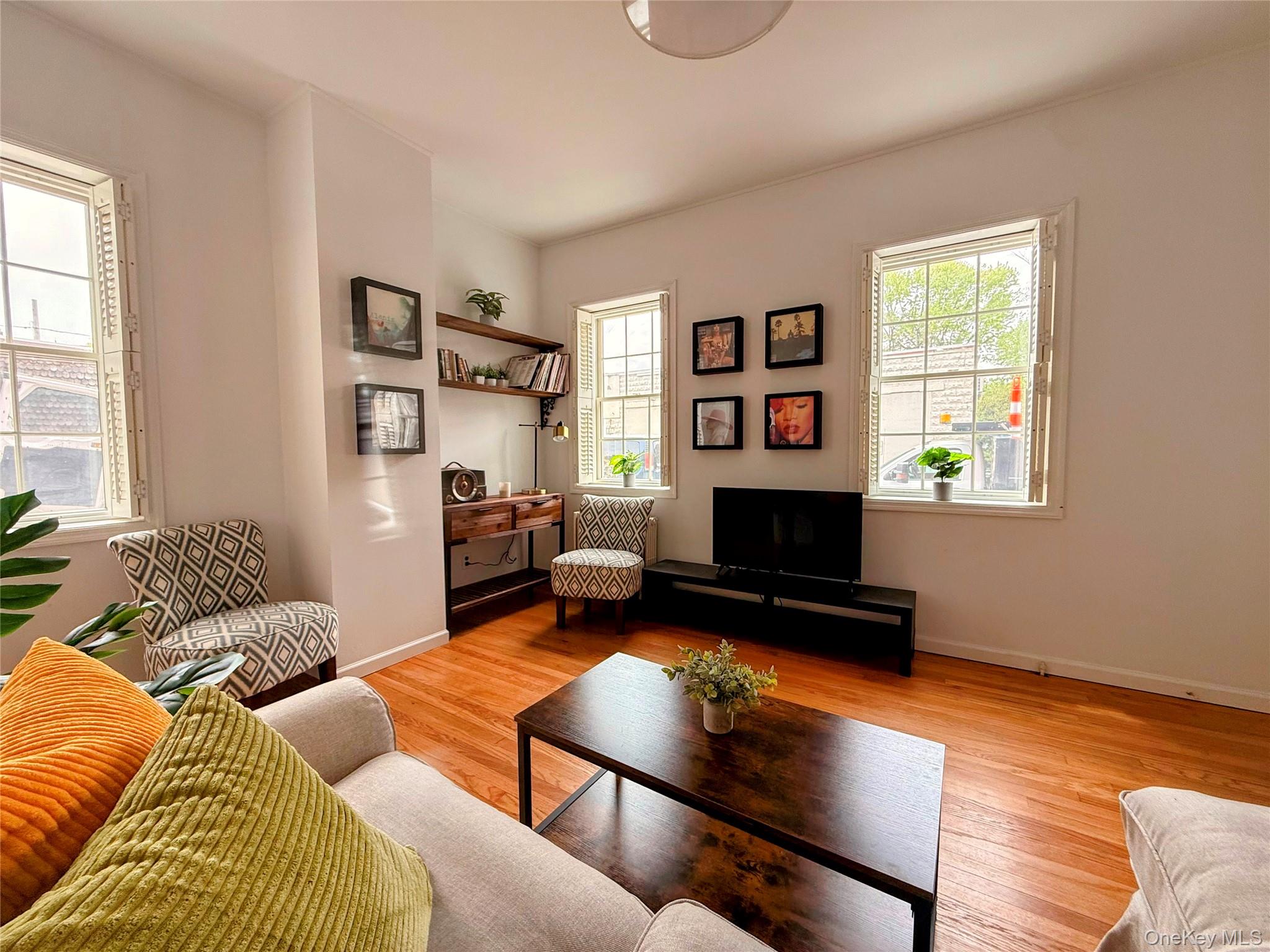 6 Church Street Cold Spring, NY 10516 - Photo 5 of 15 a living room with furniture a flat screen tv and a window