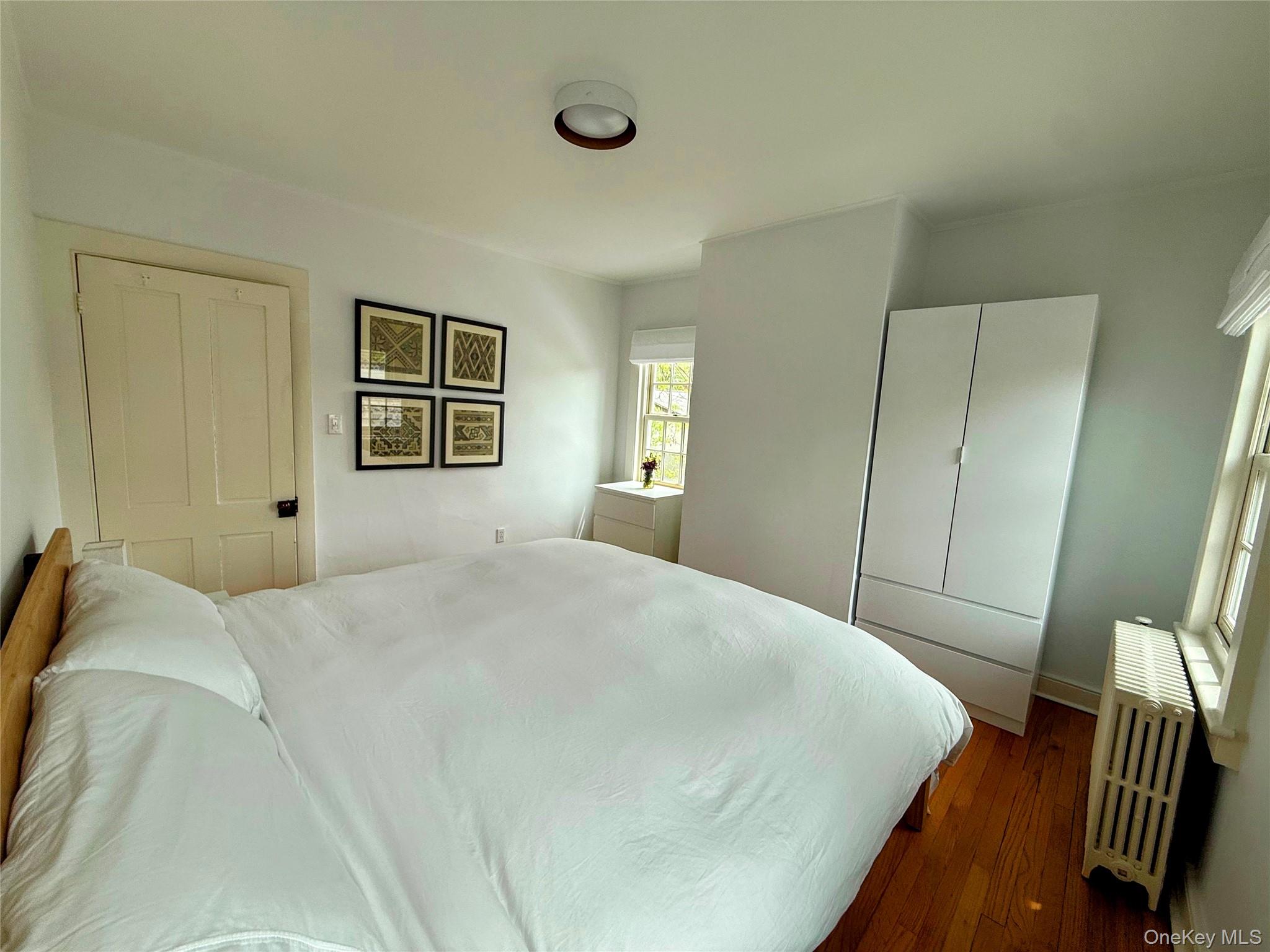 6 Church Street Cold Spring, NY 10516 - Photo 8 of 15 a bedroom with a bed and a painting on the wall