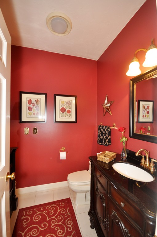 54 Phillips Road Sudbury, MA 01776 - Photo 15 of 30 a bathroom with a sink a toilet a mirror and vanity