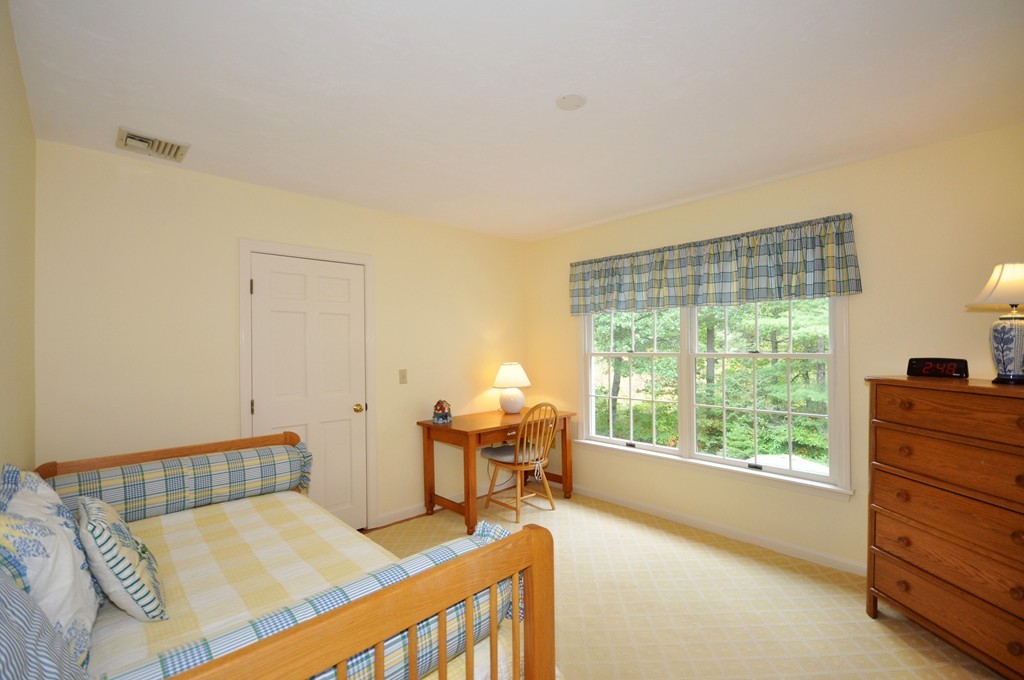 54 Phillips Road Sudbury, MA 01776 - Photo 19 of 30 a bedroom with furniture and a large window