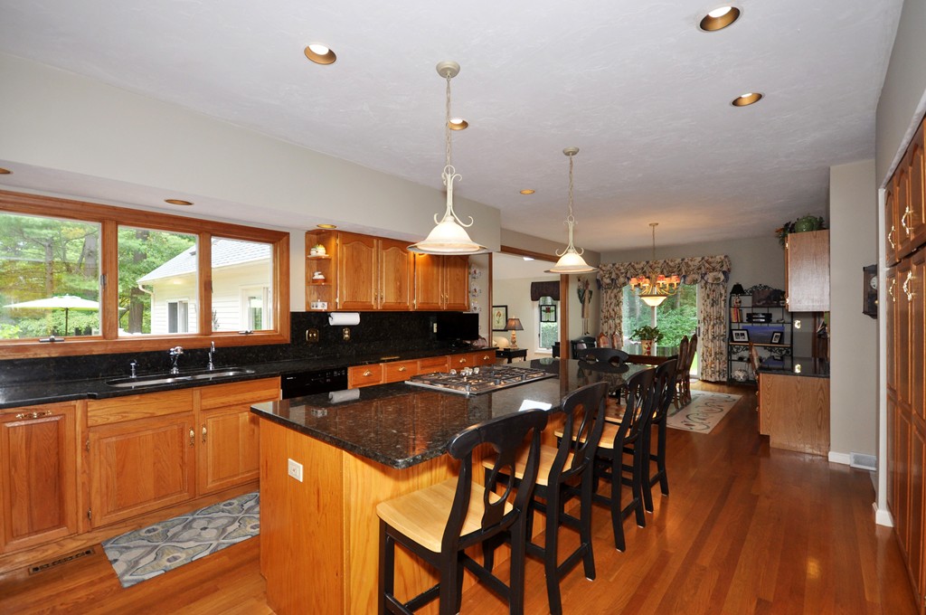 54 Phillips Road Sudbury, MA 01776 - Photo 4 of 30 a kitchen with lots of counter top space and wooden floor