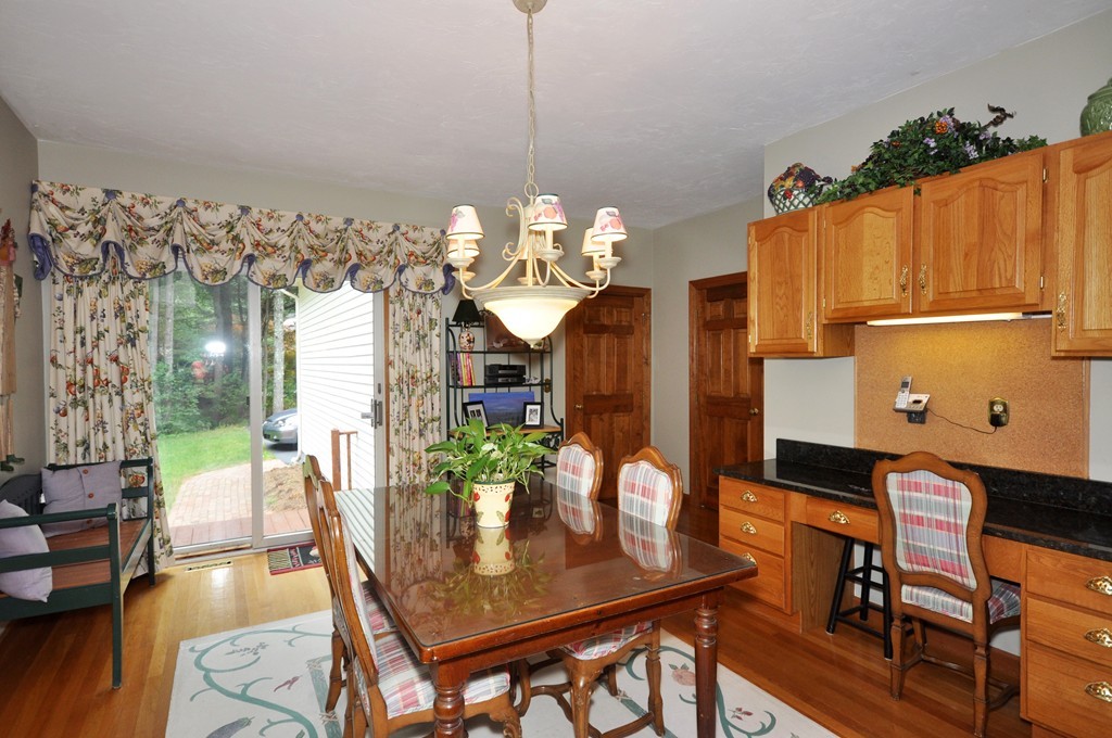 54 Phillips Road Sudbury, MA 01776 - Photo 7 of 30 a dining room with furniture and wooden floor
