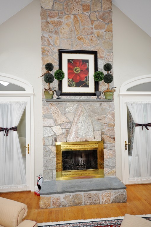 54 Phillips Road Sudbury, MA 01776 - Photo 9 of 30 a living room with a fireplace and a fireplace
