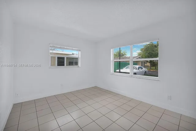 a view of a room that has a window in it