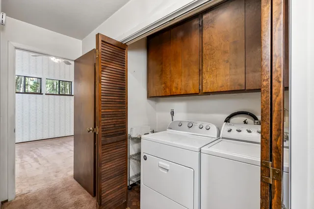 a view of empty room with ceiling fan