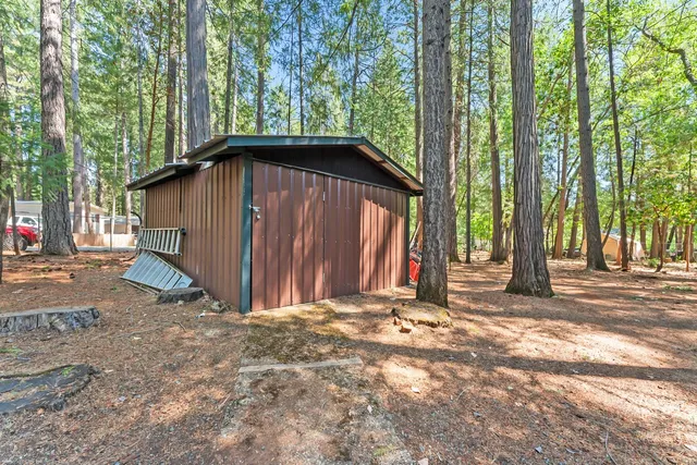 a view of outdoor space with deck and trees
