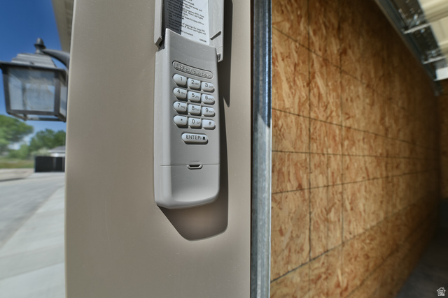 241 West Ridge Road Saratoga Springs, UT 84045 - Photo 20 of 21 Exterior keypad entry system with integrated lantern-style wall sconce