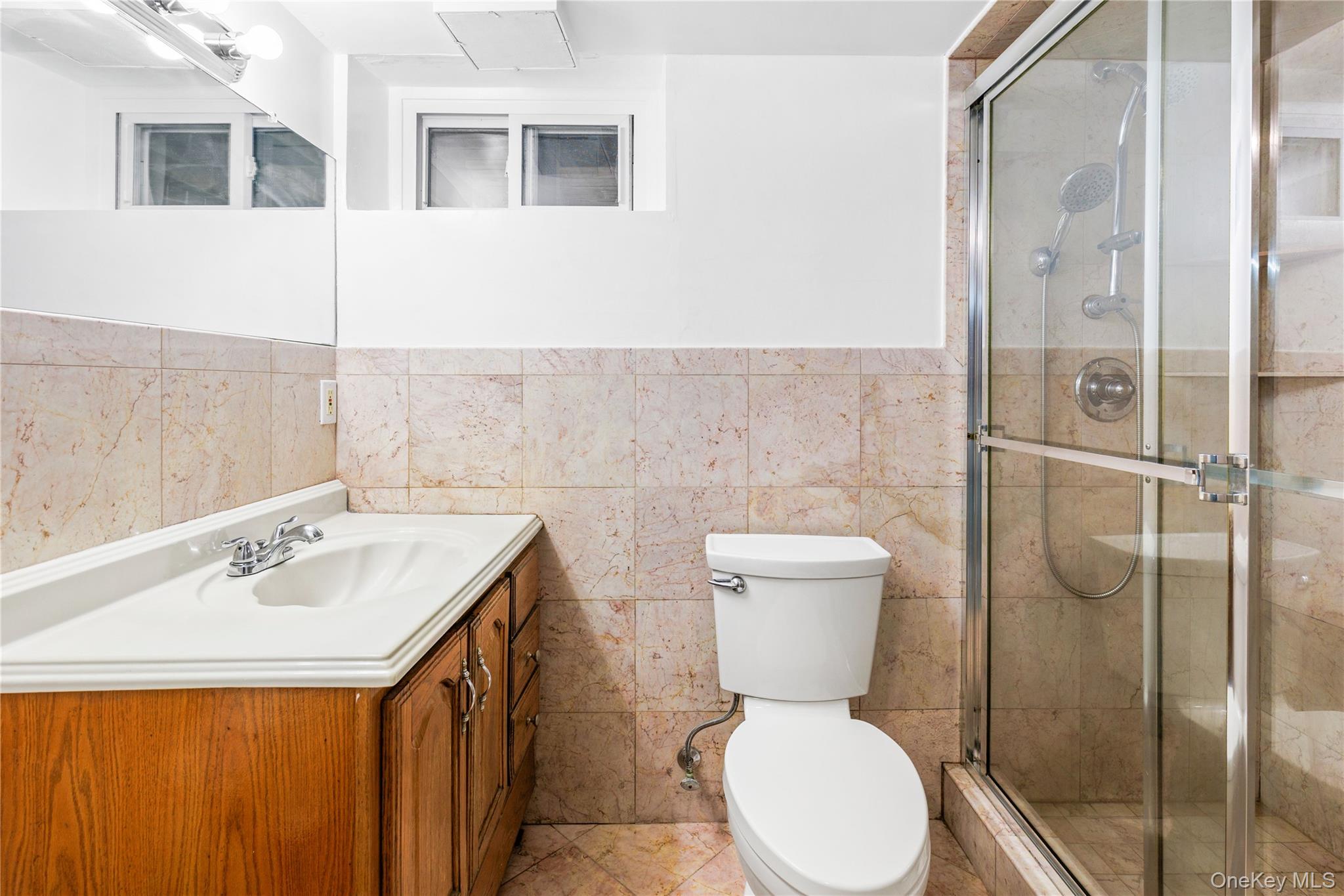 46 Mathews Street Harrison, NY 10528 - Photo 21 of 30 a bathroom with a toilet sink and shower