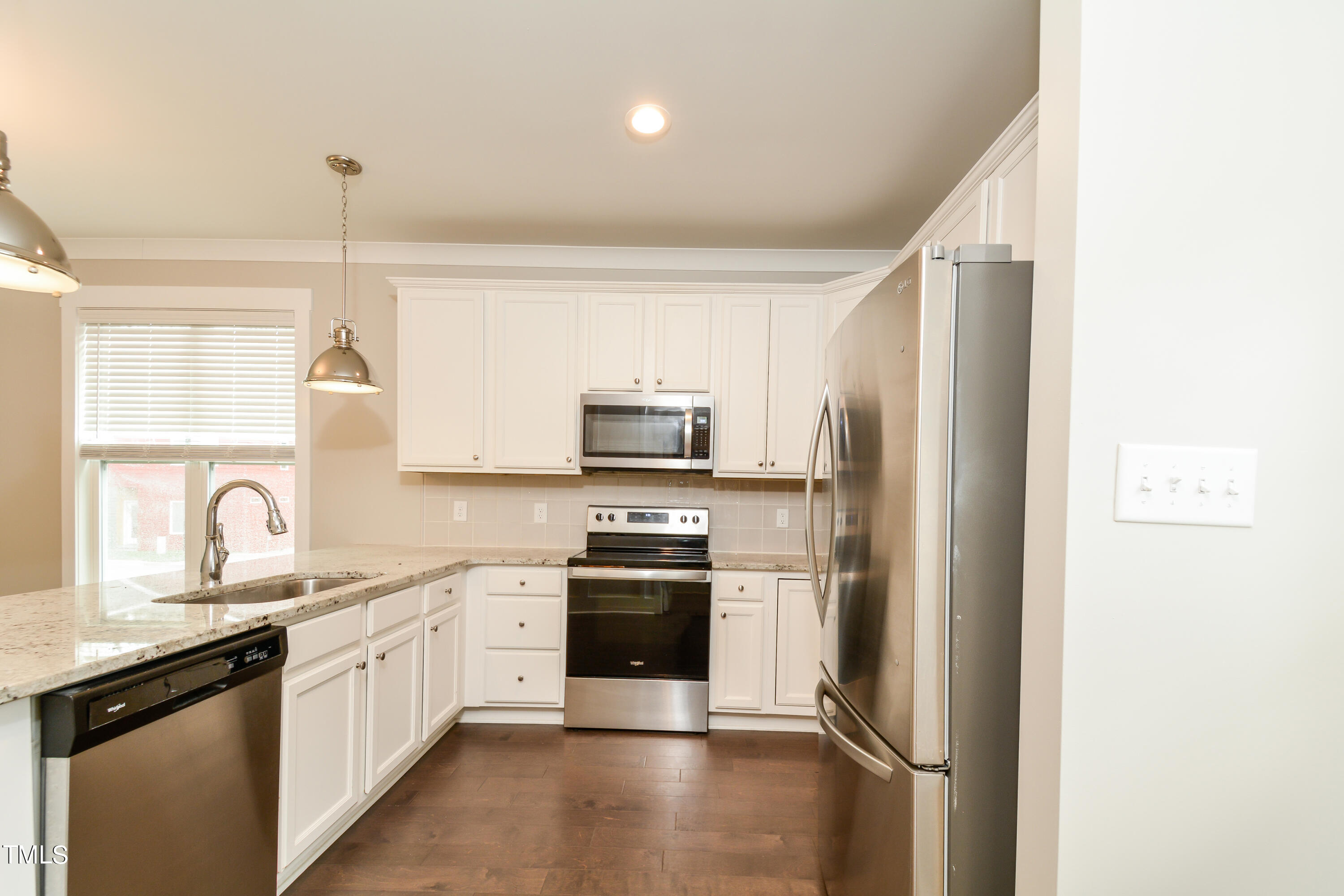 510 Eugene Street Durham, NC 27701 - Photo 2 of 15 a kitchen with a sink stainless steel appliances and window