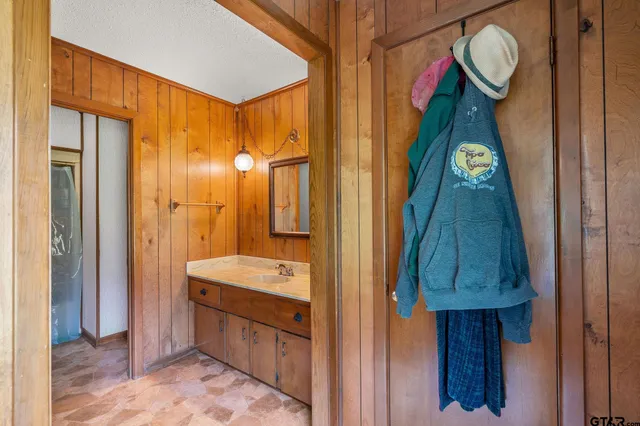 a bathroom with a double vanity sink mirror and shower