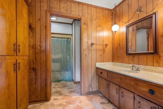 a bathroom with a tub and shower
