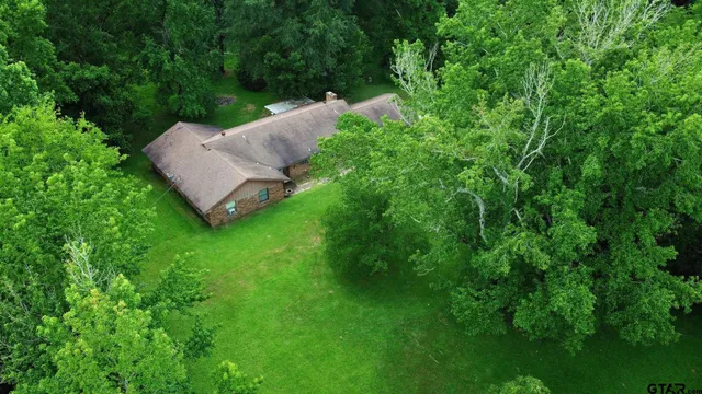 a view of a backyard with a barn