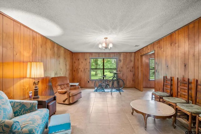 a living room with furniture and a table