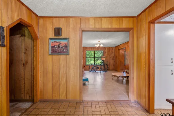a very nice looking room with a large window and chandelier
