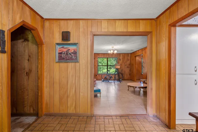 a very nice looking room with a large window and chandelier