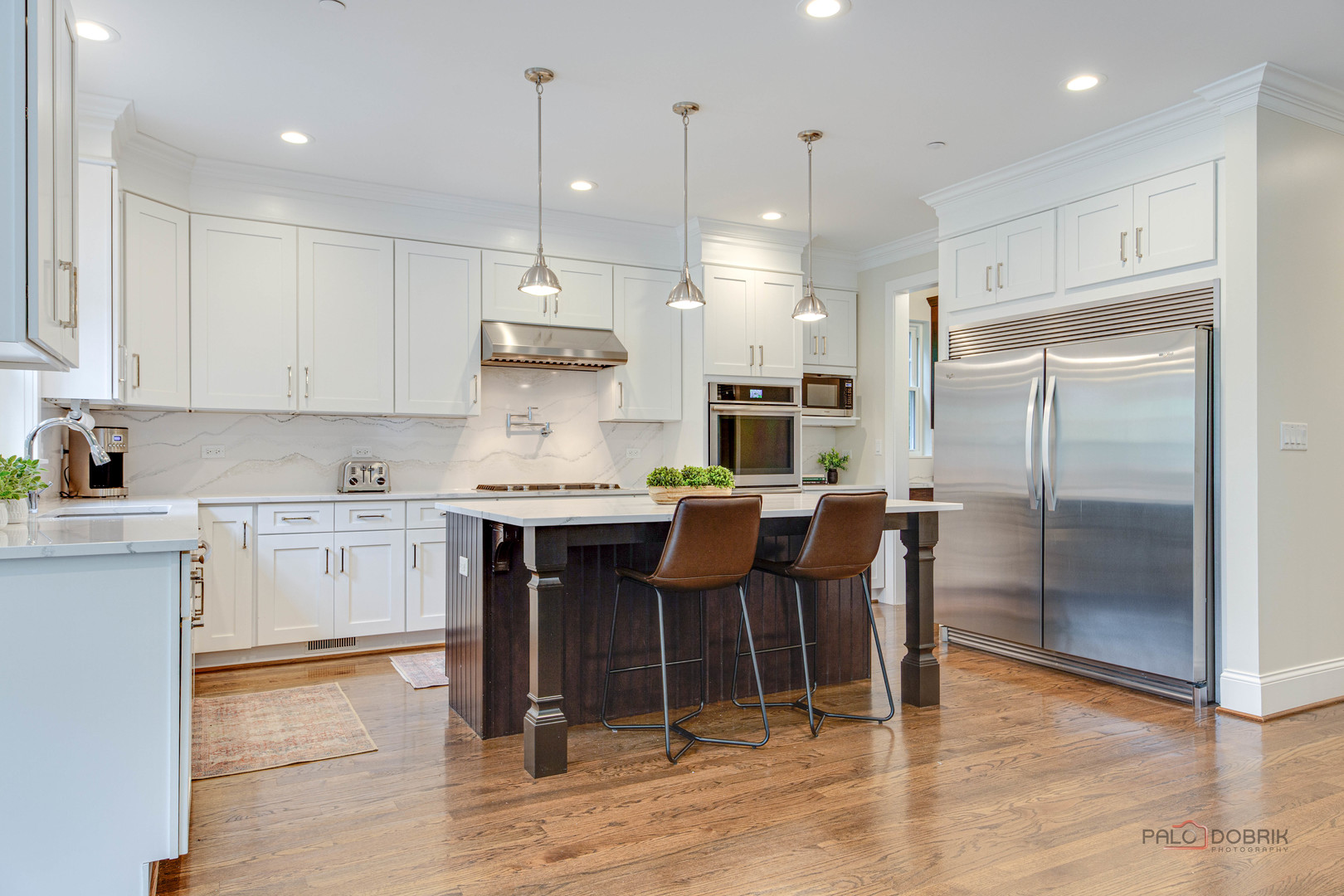 192 Gage Road Riverside, IL 60546 - Photo 13 of 56 a kitchen with stainless steel appliances granite countertop a stove a refrigerator a oven a sink a dining table and chairs with wooden floor