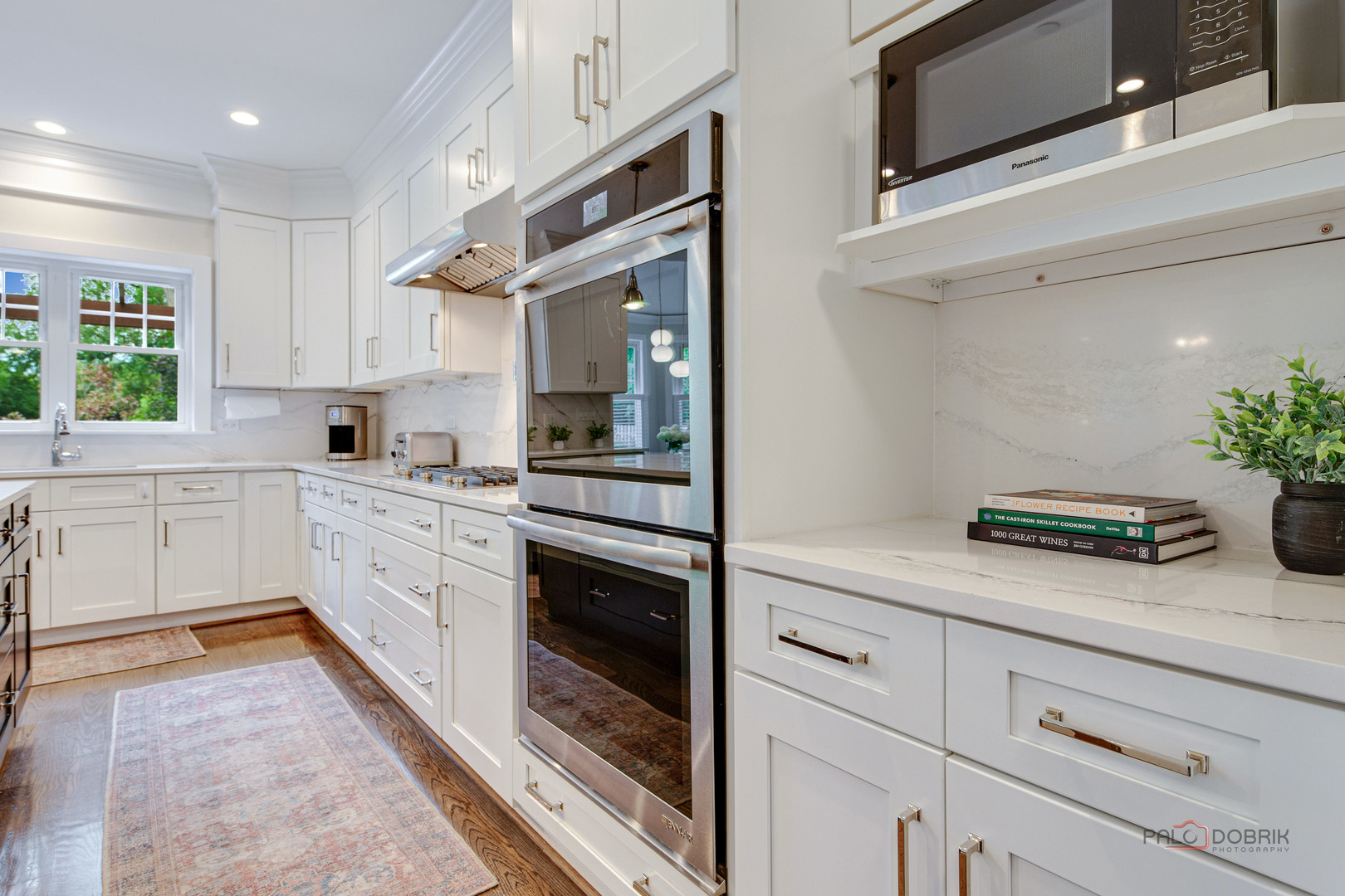 192 Gage Road Riverside, IL 60546 - Photo 15 of 56 a kitchen with granite countertop white cabinets and white appliances