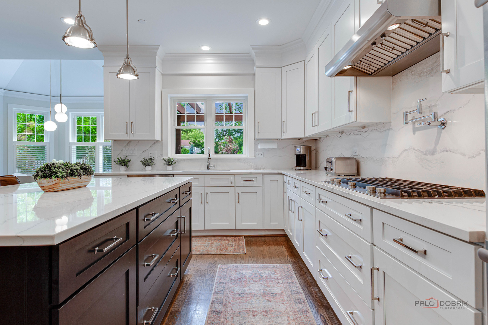 192 Gage Road Riverside, IL 60546 - Photo 16 of 56 a kitchen with granite countertop stainless steel appliances sink cabinets and window