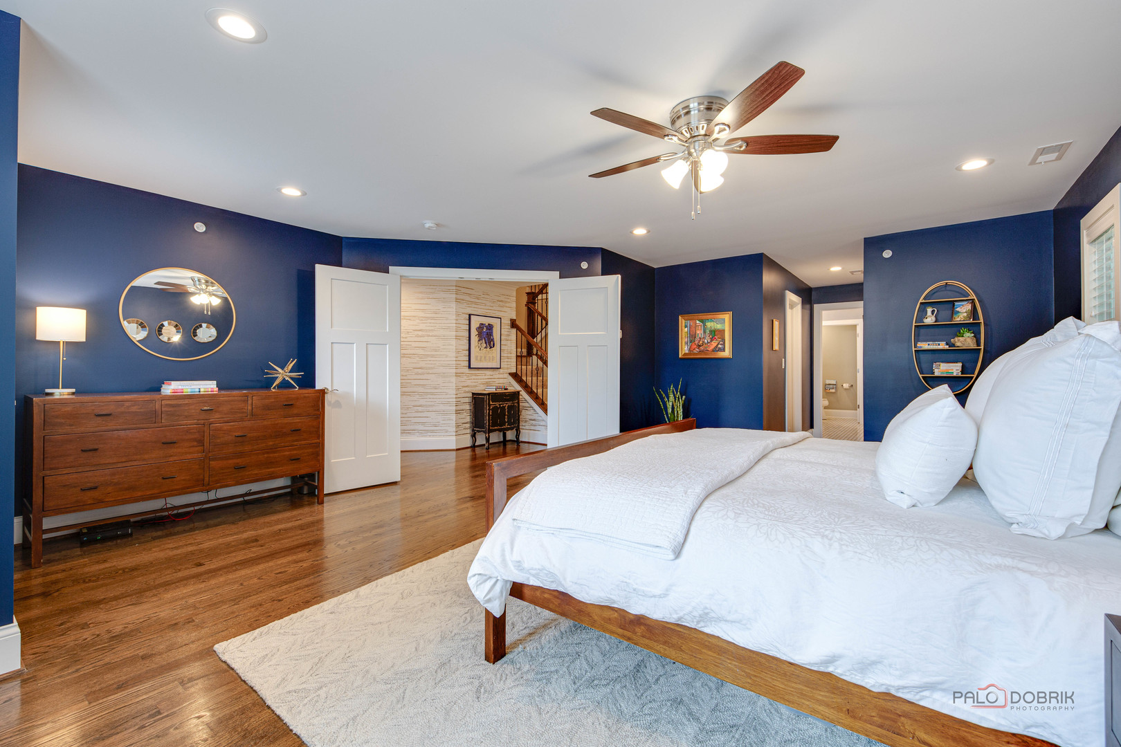 192 Gage Road Riverside, IL 60546 - Photo 25 of 56 a bedroom with a large bed and a chandelier