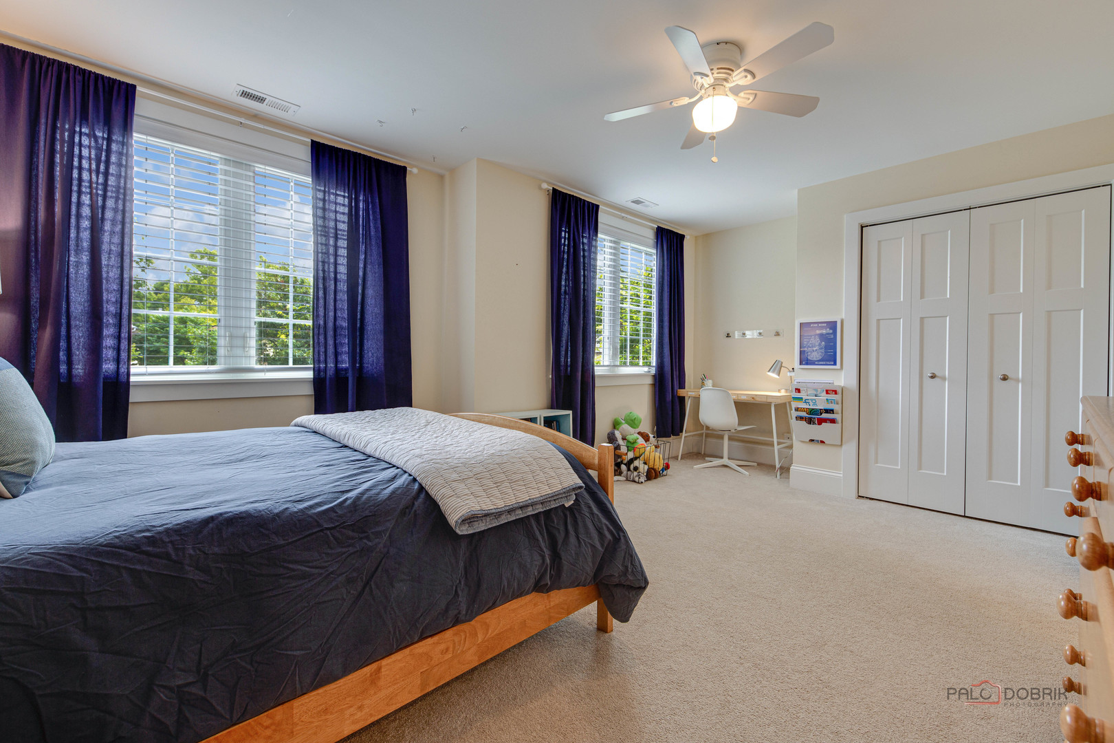 192 Gage Road Riverside, IL 60546 - Photo 32 of 56 a spacious bedroom with a bed and a chandelier