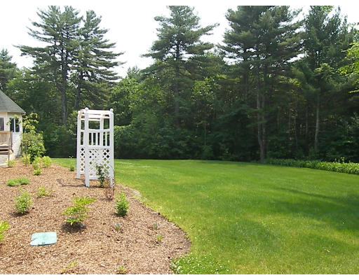52 Hardy Road, Unit 77 Bedford, NH 03110 - Photo 13 of 15 a front view of a house with a yard