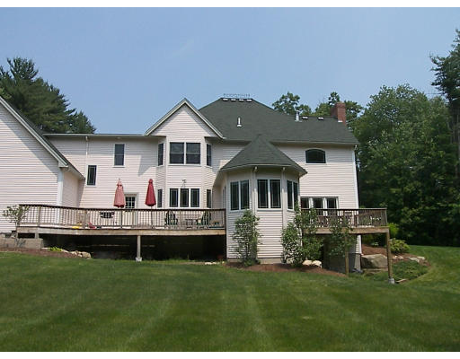 52 Hardy Road, Unit 77 Bedford, NH 03110 - Photo 14 of 15 a front view of house with yard and green space