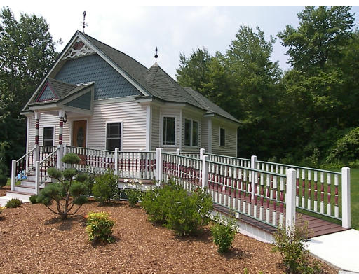 52 Hardy Road, Unit 77 Bedford, NH 03110 - Photo 15 of 15 a front view of a house with a garden