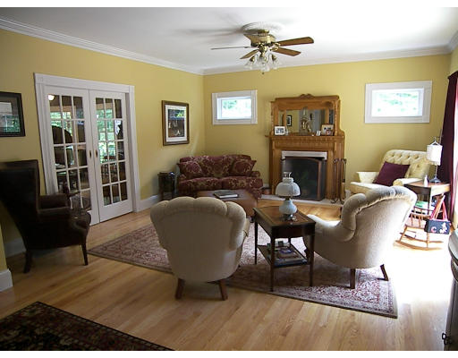 52 Hardy Road, Unit 77 Bedford, NH 03110 - Photo 5 of 15 a living room with furniture and a fireplace