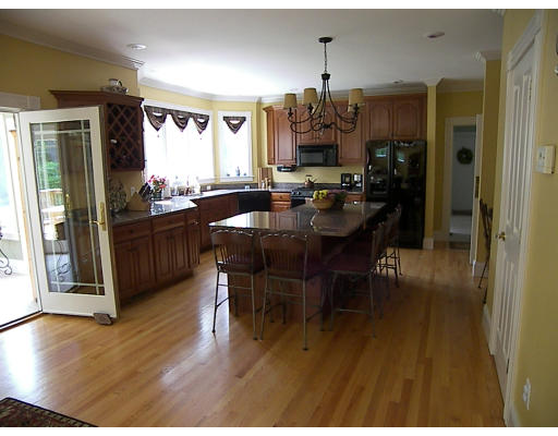 52 Hardy Road, Unit 77 Bedford, NH 03110 - Photo 6 of 15 a view of a dining room with furniture