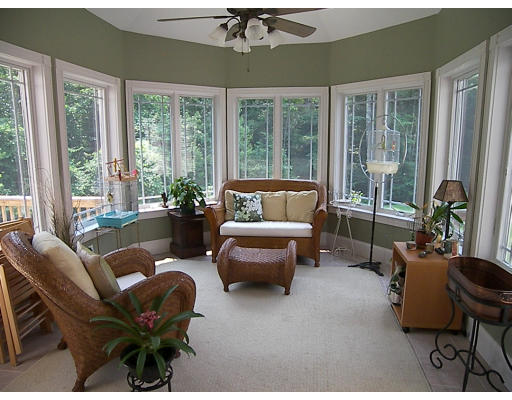 52 Hardy Road, Unit 77 Bedford, NH 03110 - Photo 7 of 15 a living room with furniture and a large window