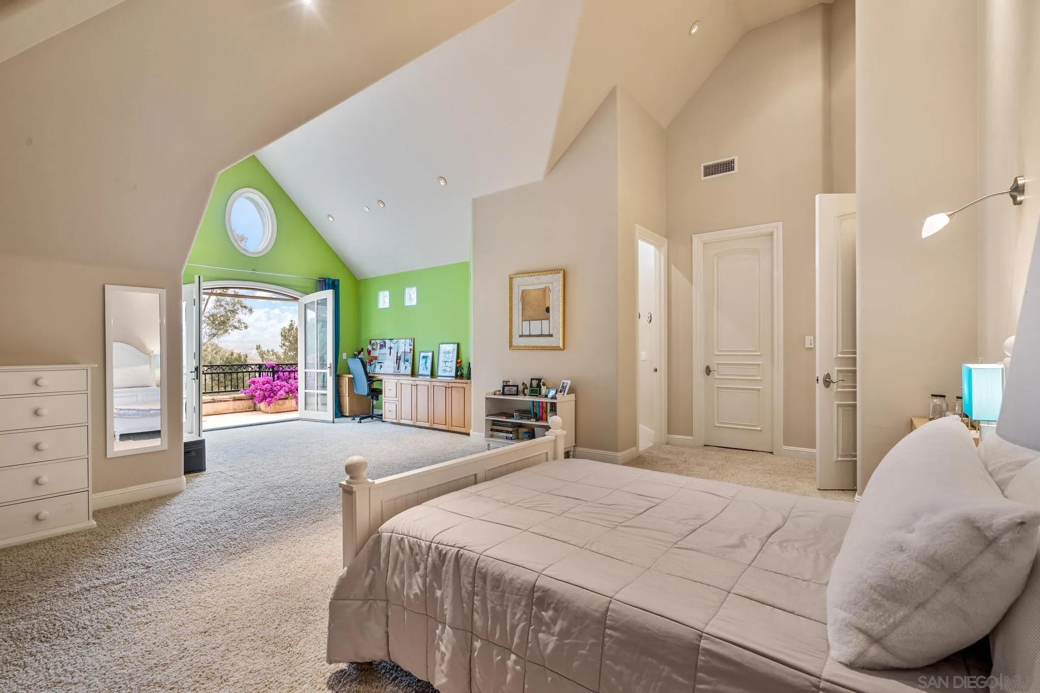 14380 Ciera Court Poway, CA 92064 - Photo 23 of 52 a spacious bedroom with a bed a dresser and window