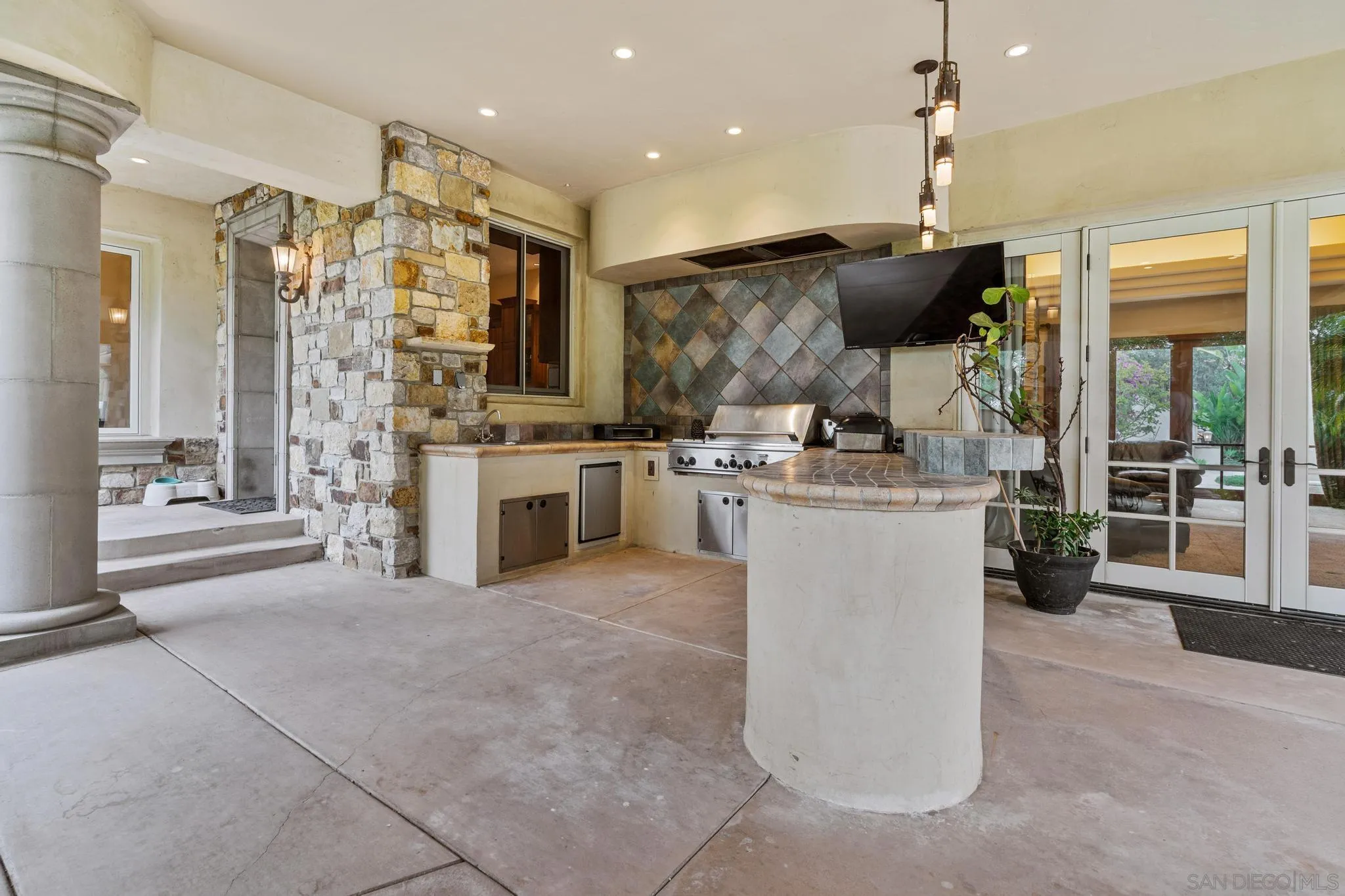 14380 Ciera Court Poway, CA 92064 - Photo 33 of 52 a view of a kitchen with furniture and a flat screen tv