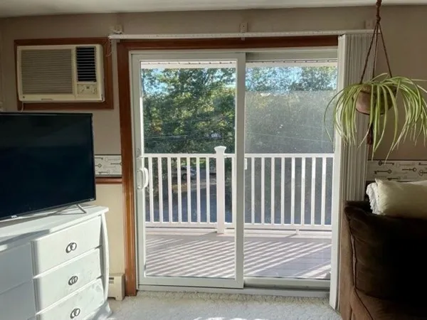 a view of a balcony with furniture and garden