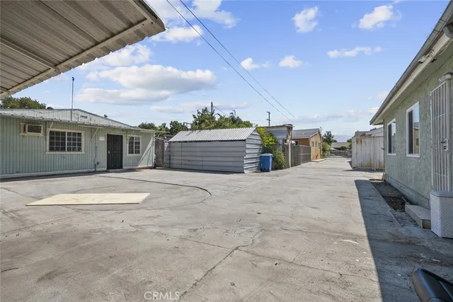 a view of a backyard of the house