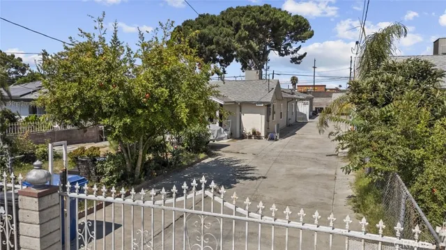 a view of a house with a tree