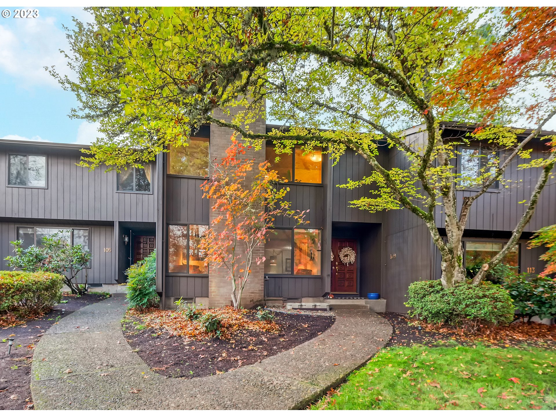 a front view of a house with garden