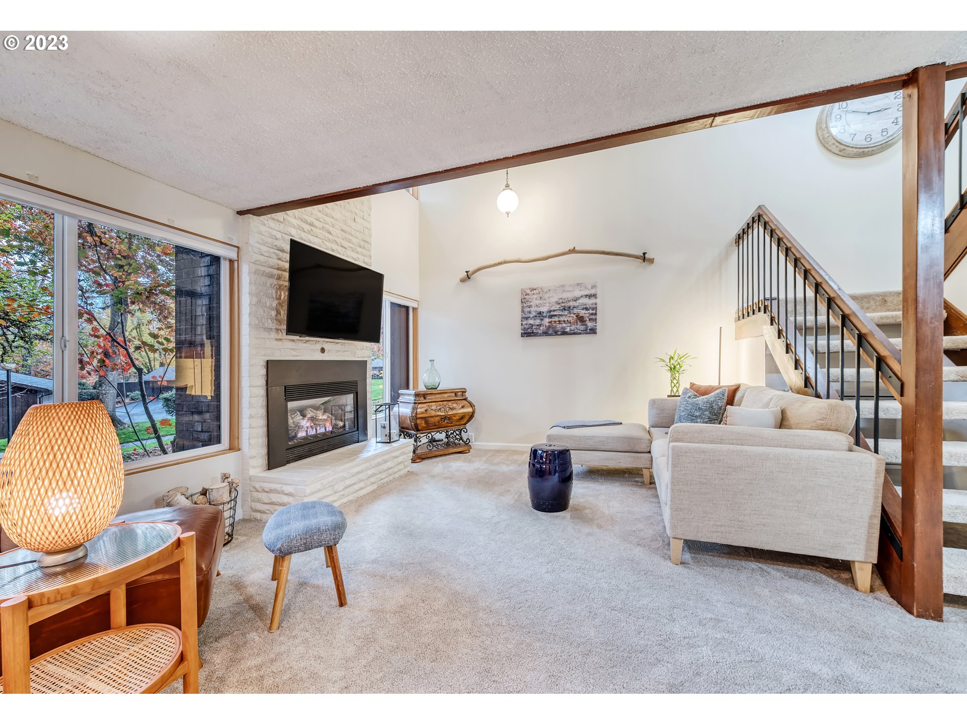 109 Westbrook Way Eugene, OR 97405 - Photo 6 of 36 a living room with furniture a fireplace and a flat screen tv