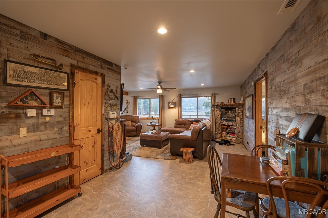 448 Edgemoor Road Big Bear Lake, CA 92315 - Photo 8 of 42 a living room with fireplace furniture and a window