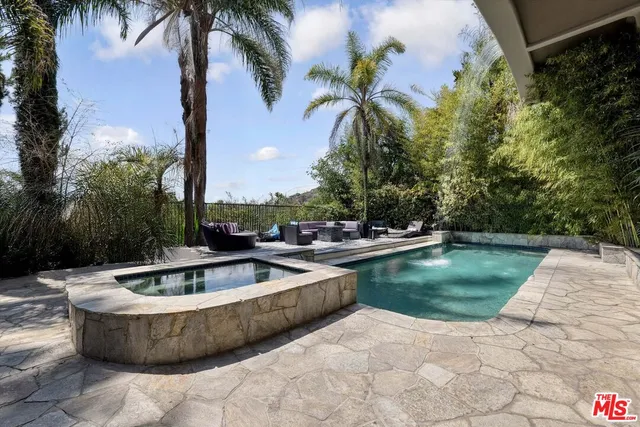 a view of swimming pool with chairs