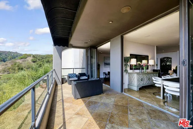 a very nice looking living room with a large window