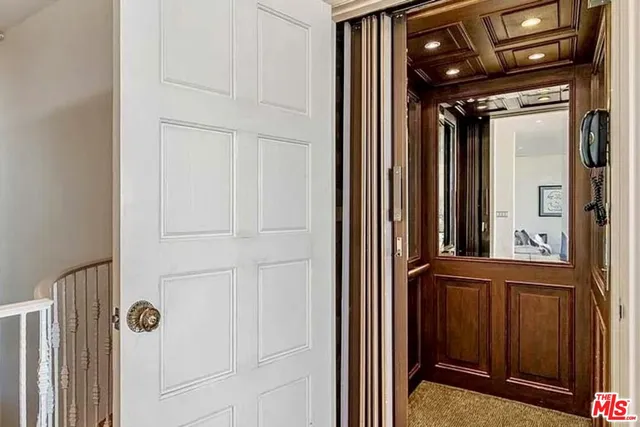 a kitchen with kitchen island granite countertop a sink and white cabinets