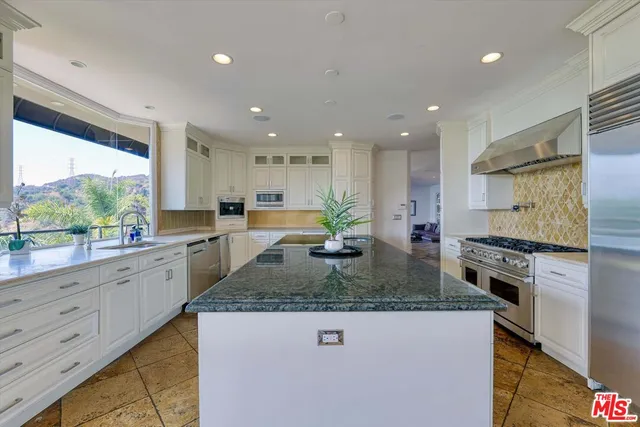 a bathroom with a mirror and a sink