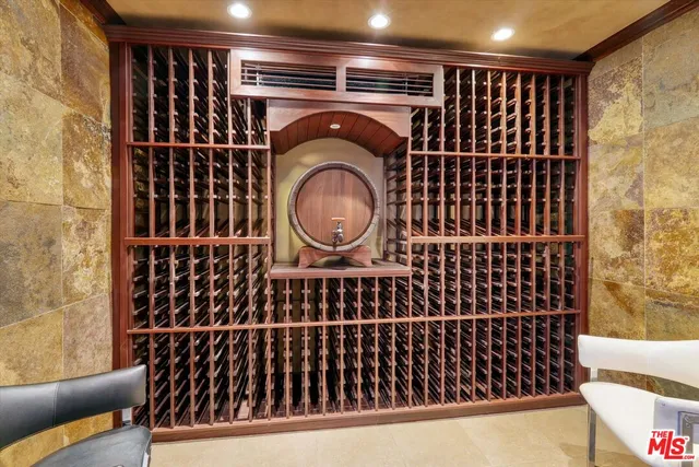 a room with pool table and windows